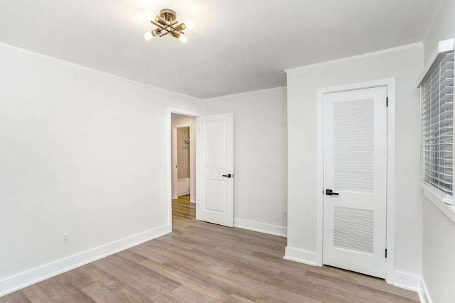 1091 Pine St, Conyers, GA 30012 - unfurnished bedroom featuring wood finished floors and ornamental molding