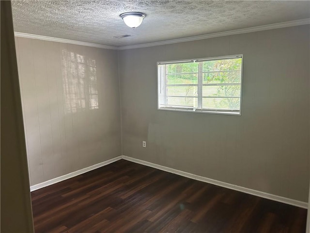 6956 Kimberland Gardens Ln, Lithonia, GA 30058 - empty room with dark wood-style flooring, baseboards, a textured ceiling, and ornamental molding