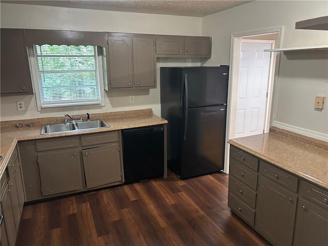 6956 Kimberland Gardens Ln, Lithonia, GA 30058 - kitchen featuring black appliances, a sink, gray cabinetry, dark wood-type flooring, and light countertops