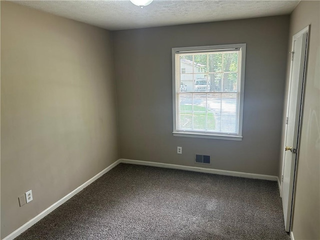 6956 Kimberland Gardens Ln, Lithonia, GA 30058 - carpeted spare room featuring healthy amount of natural light, baseboards, and a textured ceiling