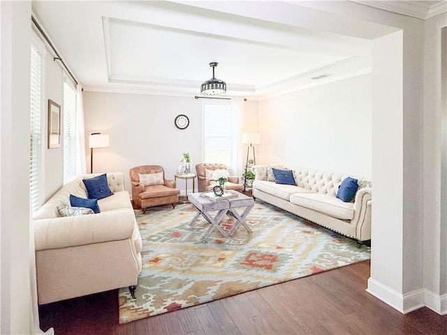 810 Pressing Dr, Alpharetta, GA 30004 - living room featuring wood finished floors, a tray ceiling, crown molding, and baseboards