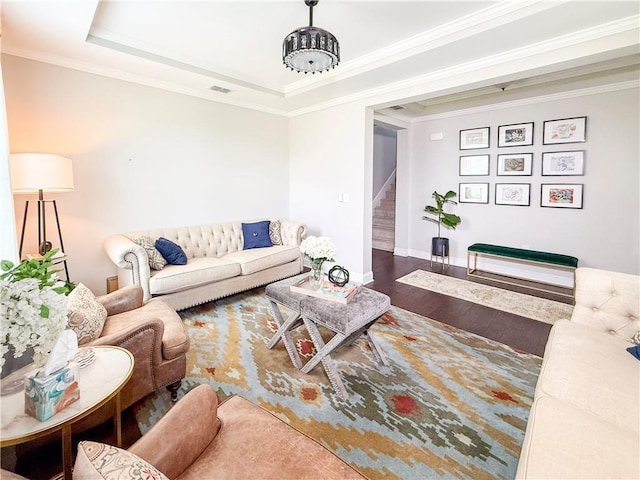810 Pressing Dr, Alpharetta, GA 30004 - living area featuring stairs, a raised ceiling, wood finished floors, ornamental molding, and baseboards