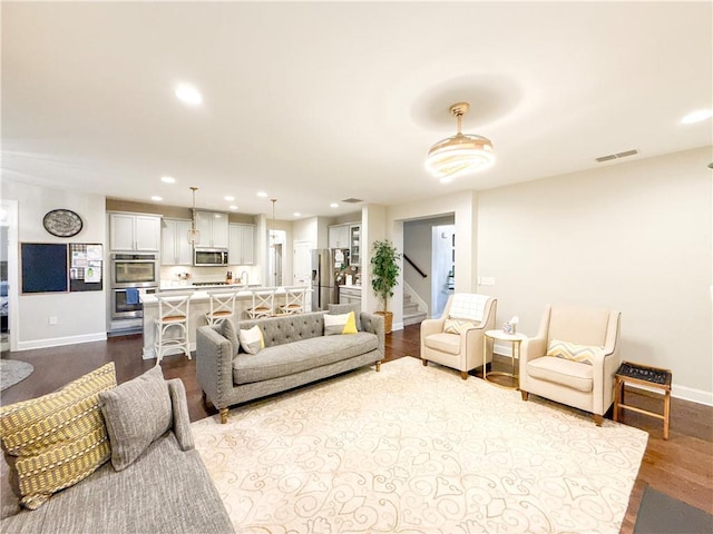 810 Pressing Dr, Alpharetta, GA 30004 - living room featuring baseboards, recessed lighting, dark wood-style flooring, and stairs