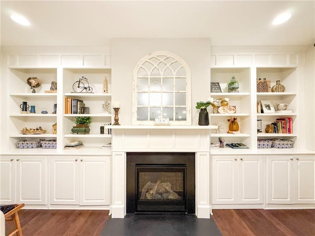 810 Pressing Dr, Alpharetta, GA 30004 - living area featuring dark wood-style floors, a fireplace with flush hearth, and built in features