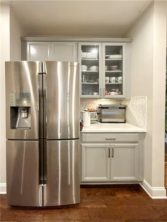 810 Pressing Dr, Alpharetta, GA 30004 - bar featuring stainless steel fridge with ice dispenser, decorative backsplash, baseboards, and dark wood finished floors