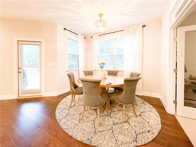 810 Pressing Dr, Alpharetta, GA 30004 - dining space featuring dark wood-style flooring, baseboards, and a chandelier