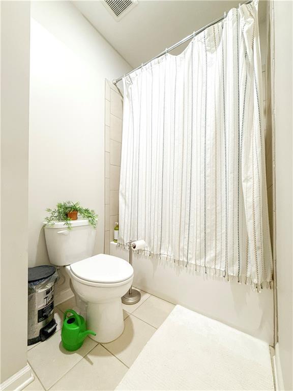 810 Pressing Dr, Alpharetta, GA 30004 - full bathroom with toilet, tile patterned flooring, and shower / bath combo