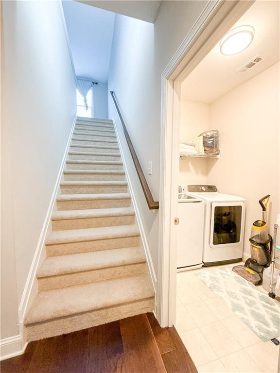 810 Pressing Dr, Alpharetta, GA 30004 - stairs with washing machine and dryer, baseboards, and wood finished floors