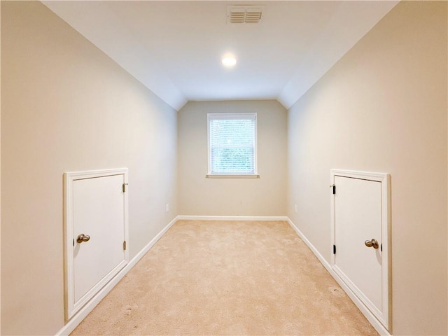 810 Pressing Dr, Alpharetta, GA 30004 - additional living space with lofted ceiling, baseboards, and light colored carpet