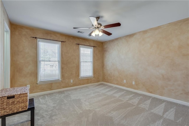 carpeted empty room with ceiling fan