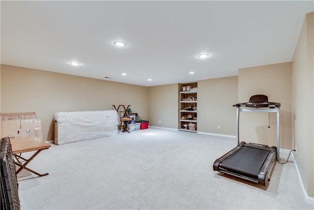 workout room with light colored carpet