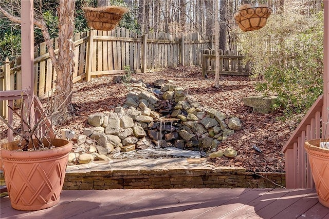 view of yard featuring a wooden deck