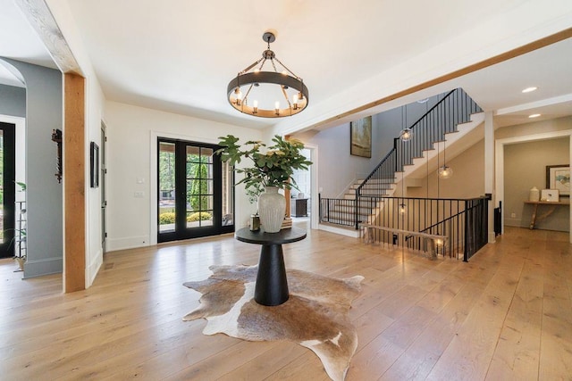 entrance foyer with recessed lighting, hardwood / wood-style floors, baseboards, and a notable chandelier