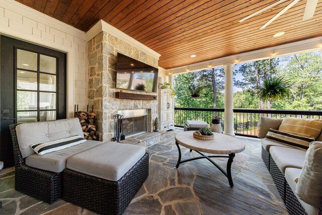 1530 Redd Rd, Milton, GA 30004 - sunroom with wood ceiling, a wealth of natural light, a wall of windows, and stone flooring