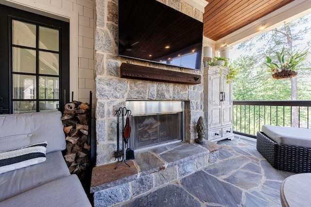 view of patio with a fireplace