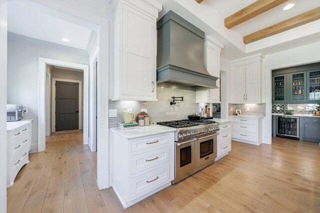 1530 Redd Rd, Milton, GA 30004 - kitchen with light wood-style flooring, visible vents, backsplash, and double oven range