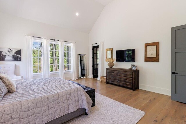 1530 Redd Rd, Milton, GA 30004 - bedroom with high vaulted ceiling, recessed lighting, and light wood-style flooring