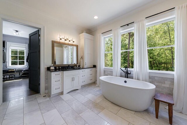 1530 Redd Rd, Milton, GA 30004 - bathroom with a soaking tub, ensuite bathroom, vanity, and ornamental molding