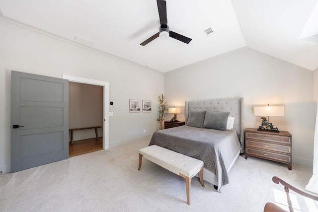 bedroom with lofted ceiling, visible vents, a ceiling fan, baseboards, and light colored carpet