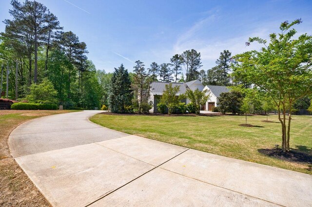 1530 Redd Rd, Milton, GA 30004 - view of front of property with stone siding and a balcony