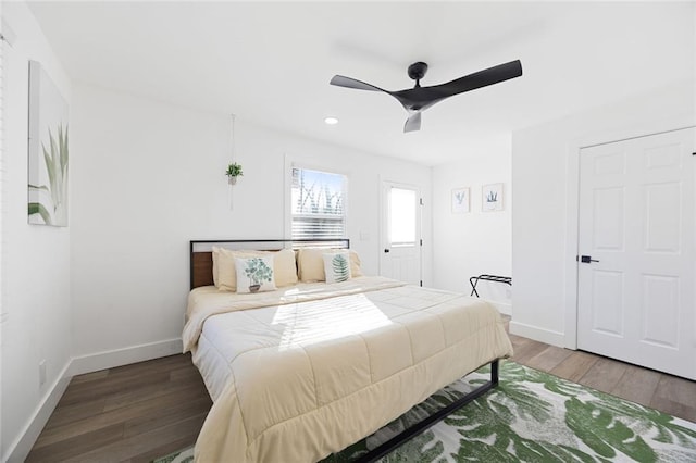 bedroom with hardwood / wood-style floors and ceiling fan