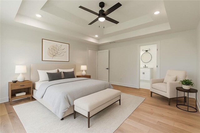 6073 Rockingham Way, Gainesville, GA 30506 - bedroom with a raised ceiling, recessed lighting, baseboards, ensuite bathroom, and light wood-type flooring
