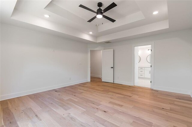 6073 Rockingham Way, Gainesville, GA 30506 - unfurnished bedroom featuring visible vents, light wood-type flooring, baseboards, a tray ceiling, and recessed lighting