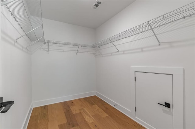 6073 Rockingham Way, Gainesville, GA 30506 - walk in closet featuring visible vents and wood finished floors