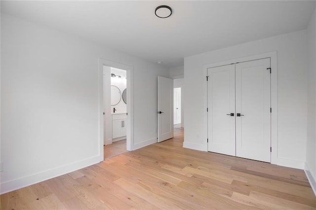 6073 Rockingham Way, Gainesville, GA 30506 - unfurnished bedroom with baseboards, ensuite bath, a closet, and light wood-type flooring