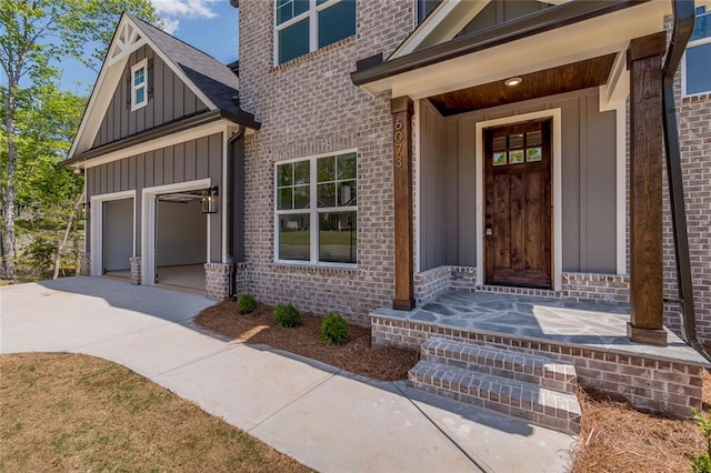 6073 Rockingham Way, Gainesville, GA 30506 - entrance to property featuring board and batten siding, brick siding, and concrete driveway