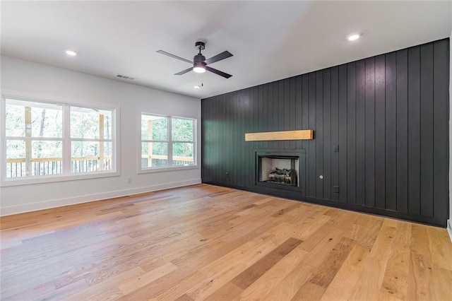 6073 Rockingham Way, Gainesville, GA 30506 - unfurnished living room featuring ceiling fan, a fireplace, baseboards, wood finished floors, and visible vents