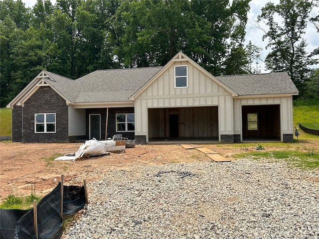 60 Barnwood Ct, Dallas, GA 30132 - view of front of property featuring an attached garage, board and batten siding, roof with shingles, and driveway