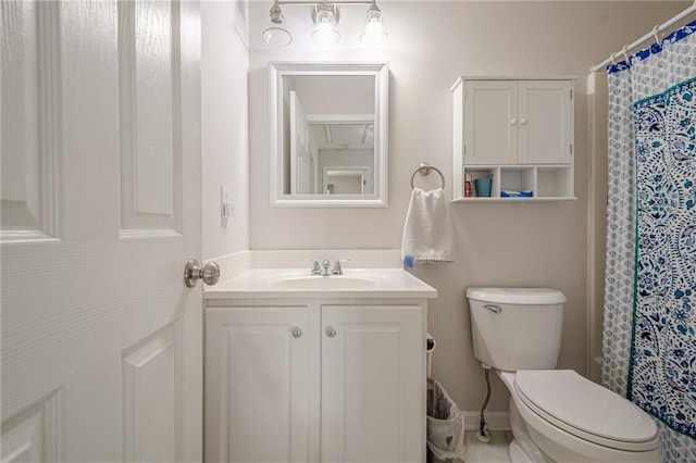 bathroom with toilet and vanity