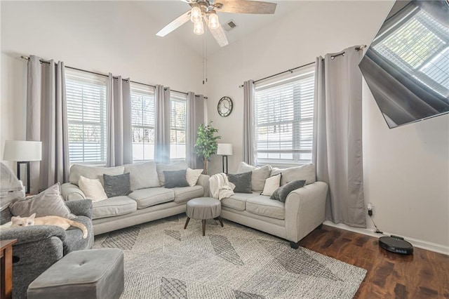 living room featuring visible vents, a healthy amount of sunlight, ceiling fan, and wood finished floors