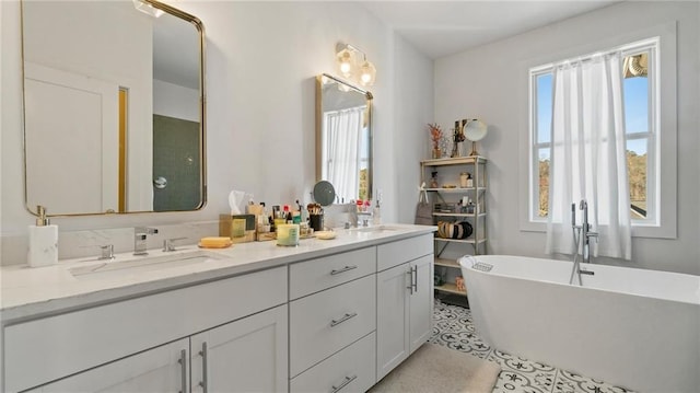 bathroom with vanity, tile patterned floors, and a tub