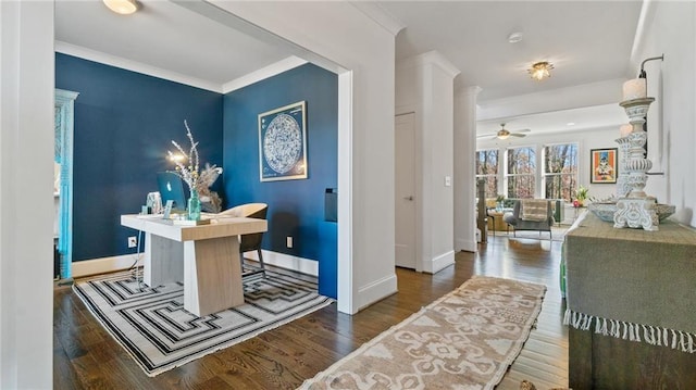 office space featuring dark hardwood / wood-style floors, ceiling fan, and crown molding