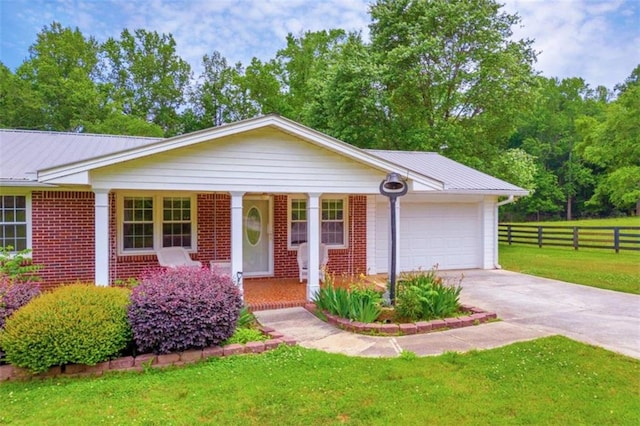 ranch-style home with a front lawn and a garage