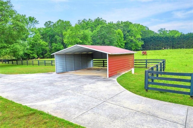 garage with a lawn and a carport