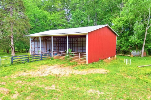 view of shed / structure with a lawn