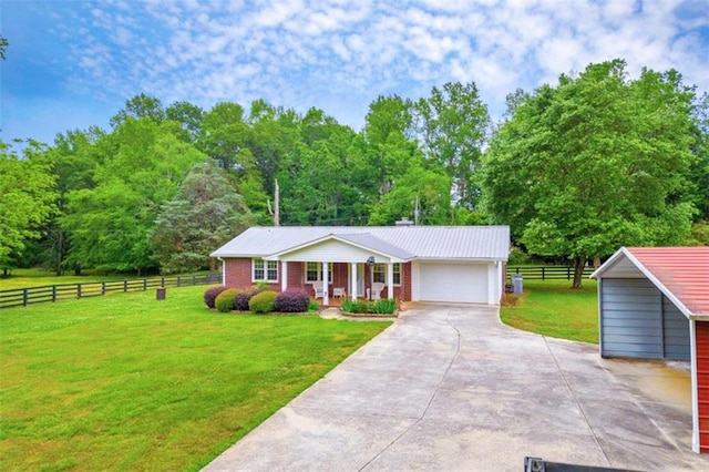 view of front of home with a garage and a front lawn