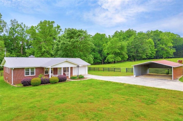 view of front facade featuring a carport and a front lawn