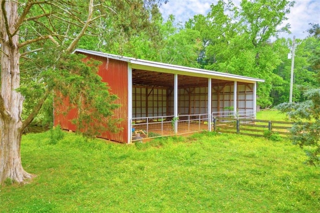 view of shed / structure with a lawn