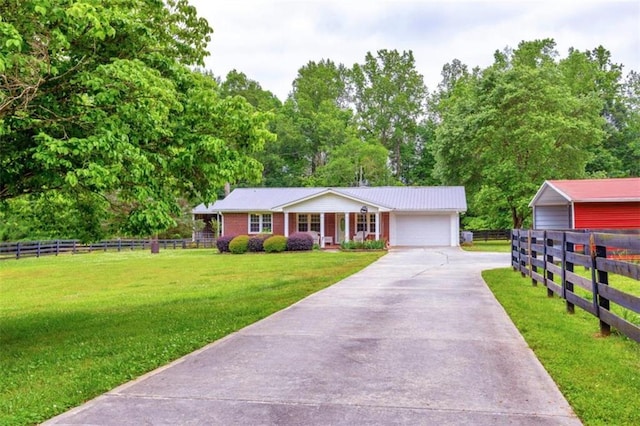 view of front of home with a front lawn and a garage