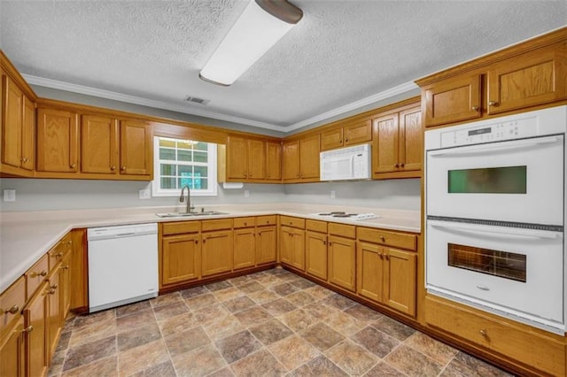 kitchen with crown molding, a textured ceiling, white appliances, sink, and light tile floors