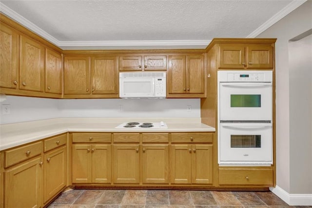 kitchen with light tile floors, white appliances, a textured ceiling, and crown molding