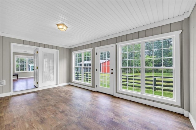 unfurnished sunroom with a wealth of natural light