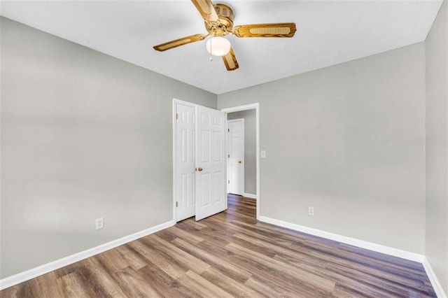 interior space with ceiling fan and hardwood / wood-style flooring