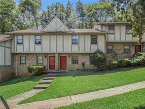 tudor house featuring a front yard