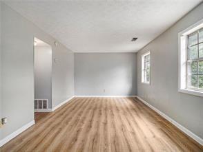 spare room featuring light hardwood / wood-style floors