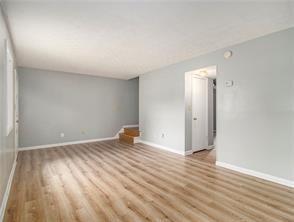 spare room featuring light hardwood / wood-style flooring